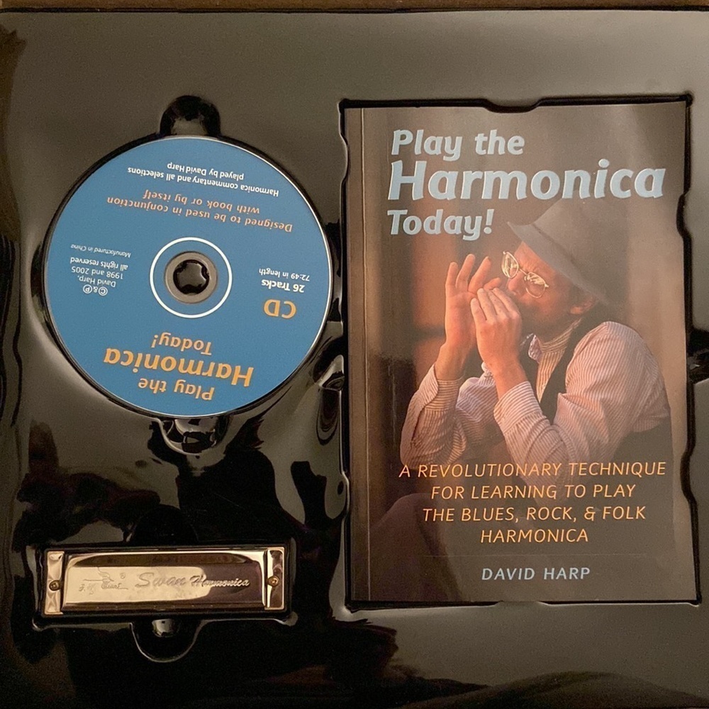 Harmonica with CD and instruction booklet. All in one— the gift of music.